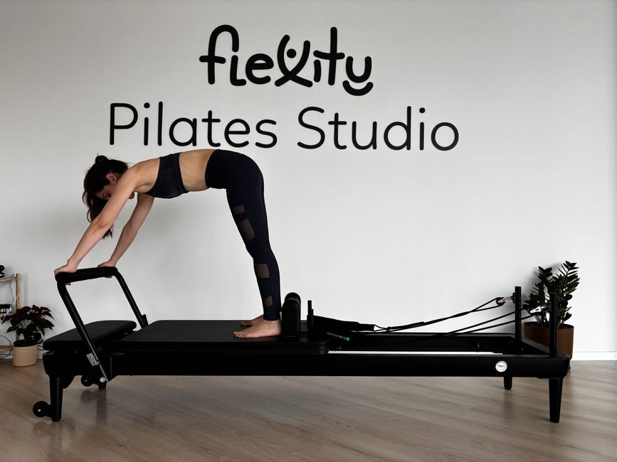 Pilates accessories laid out neatly including ball, ring, and bands