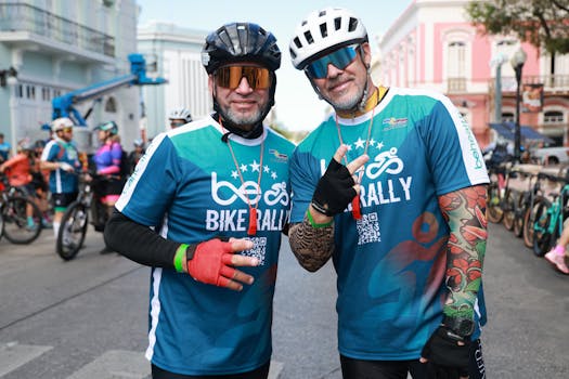 Energetic bike rally event with smiling cyclists ready to ride in urban street setting.