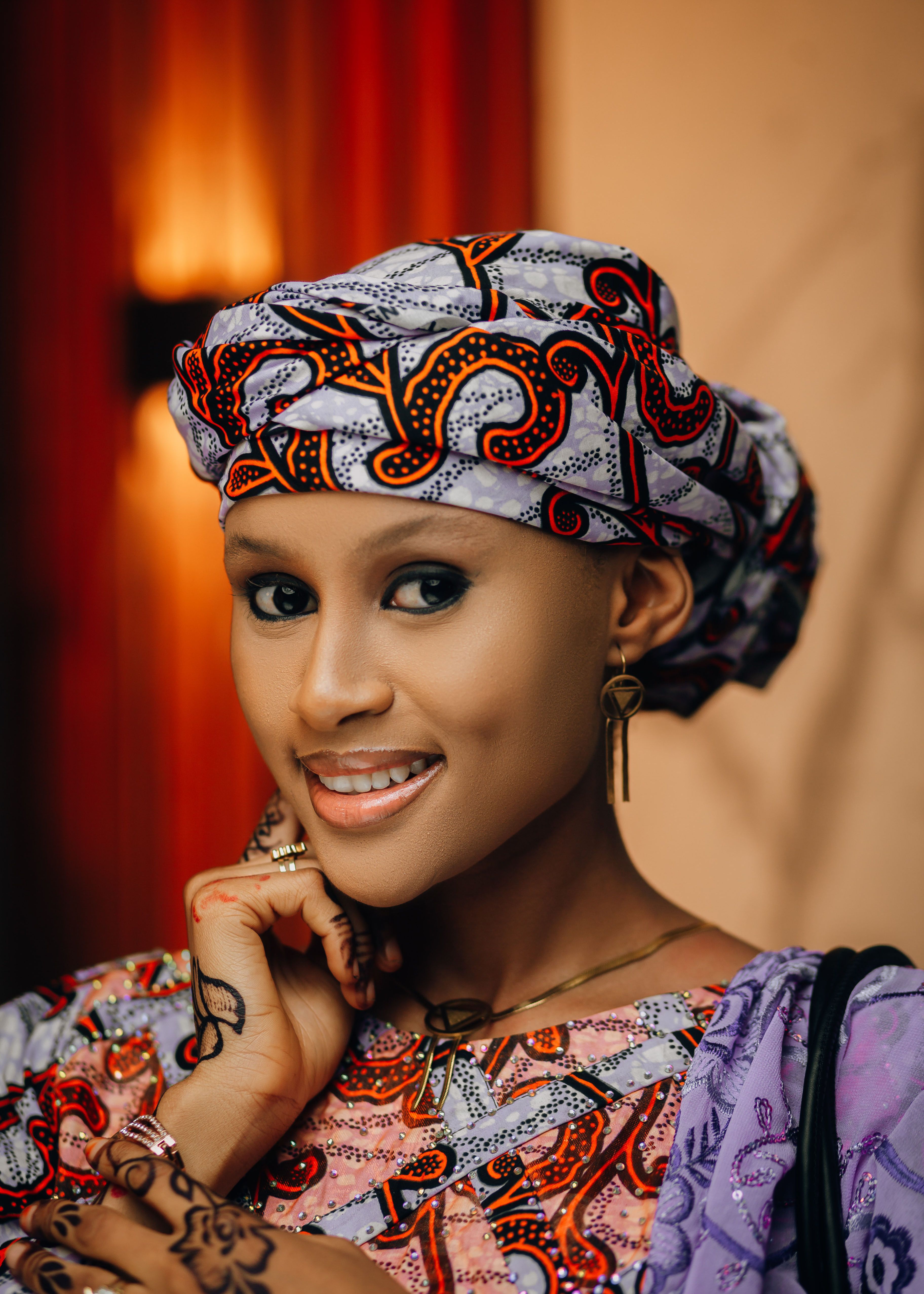 Smiling Woman in Vibrant Traditional Attire · Free Stock Photo