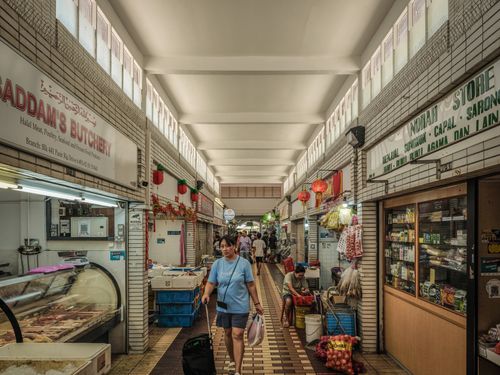 Free A vibrant indoor market with various stalls and shoppers strolling the aisles. Stock Photo