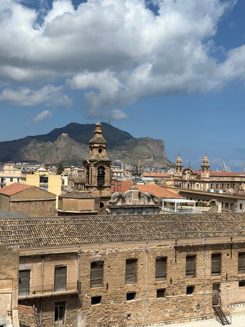 Free View of Palermo's historic architecture with Mount Pellegrino in the background, Sicily, Italy. Stock Photo
