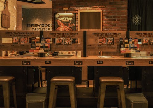 Warm, inviting Japanese restaurant interior with bar seating, perfect for a casual dining experience.