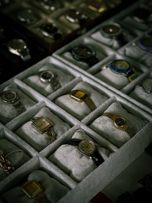Free A curated collection of luxury watches displayed in neatly arranged boxes. Stock Photo