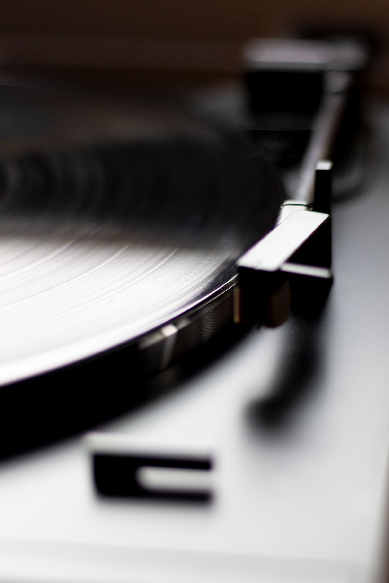 Close view of a vinyl record spinning on a turntable.