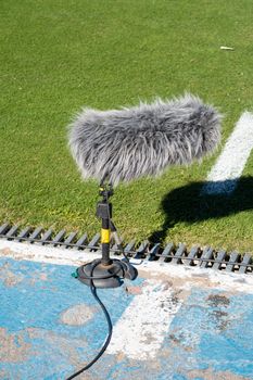 Broadcast audio engineering console using AI to isolate sideline interviews.