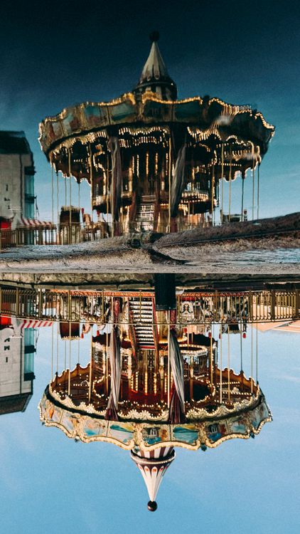 Charming Vintage Carousel with Reflection · Free Stock Photo
