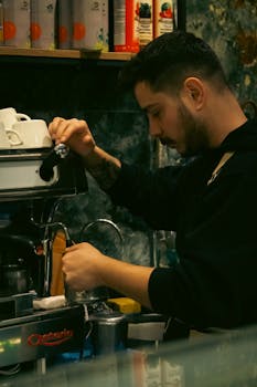 A barista skillfully making coffee in a cozy cafe in Çanakkale, Türkiye. Warm and inviting atmosphere.