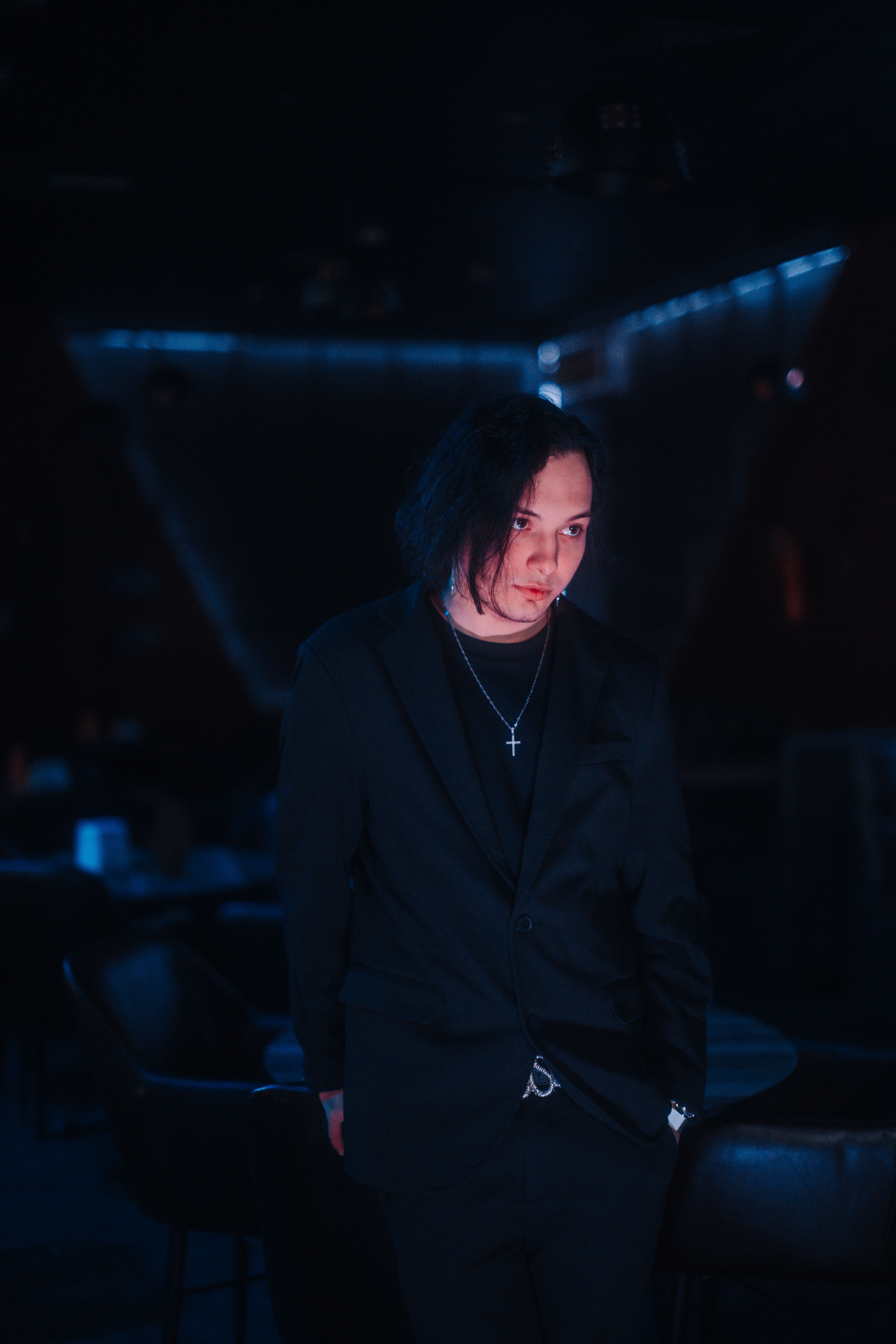 Moody Portrait of a Man in Dimly Lit Bar · Free Stock Photo