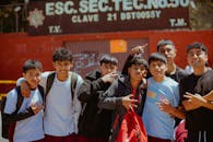 Group of Teens Posing Outside a School