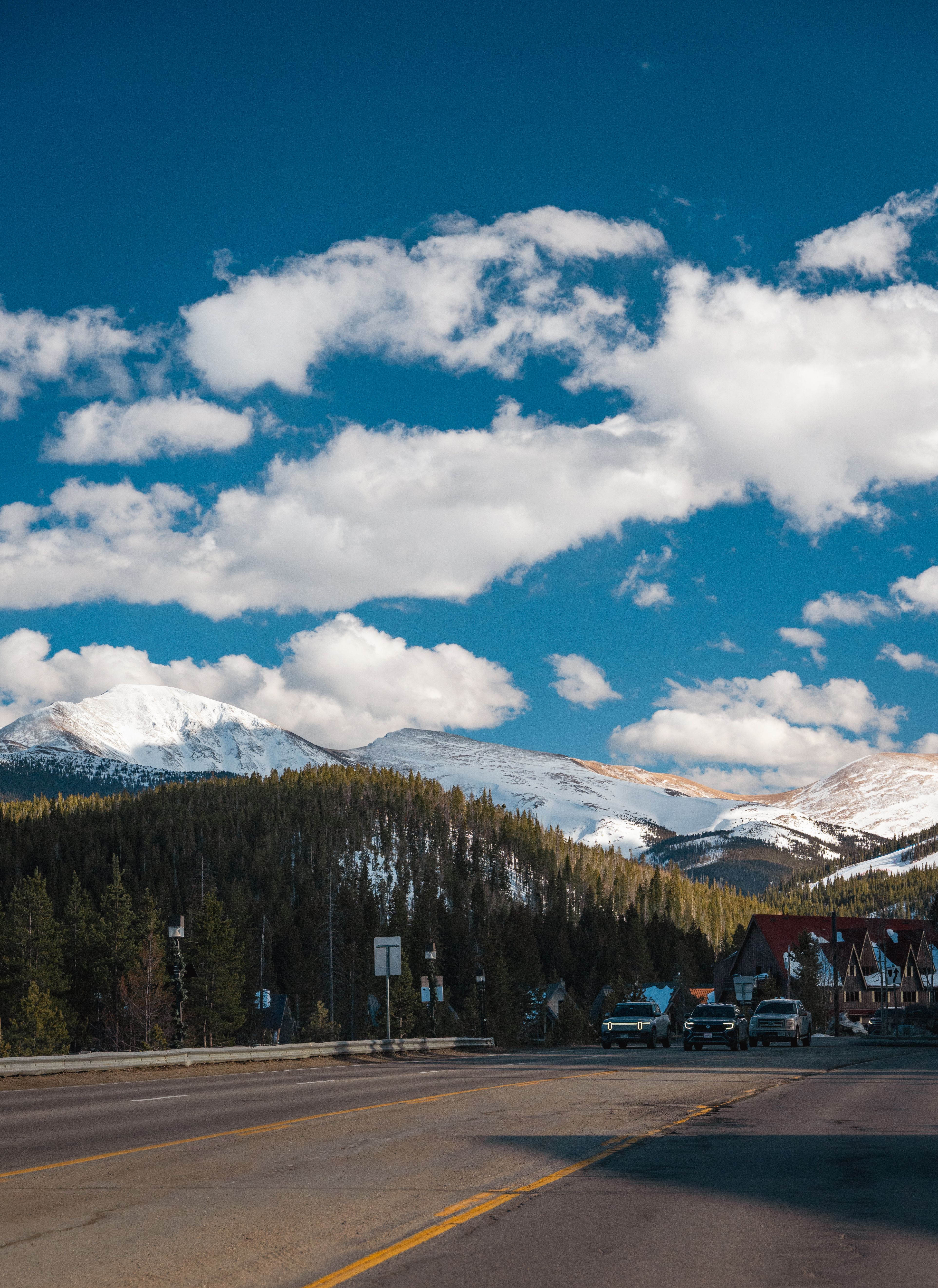 Scenic Mountain Road with Snow-Capped Peaks · Free Stock Photo