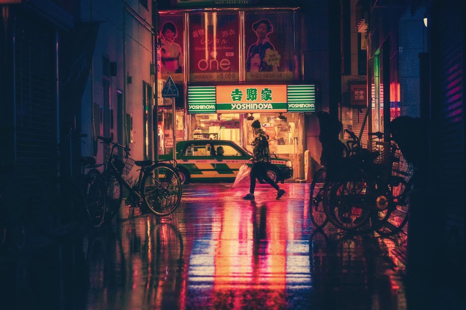 Side View of  Woman in Illuminated City at Night