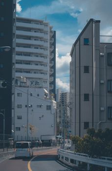 Street scene in Tokyo's Kita Ward showcasing residential and urban architecture on a cloudy day.
