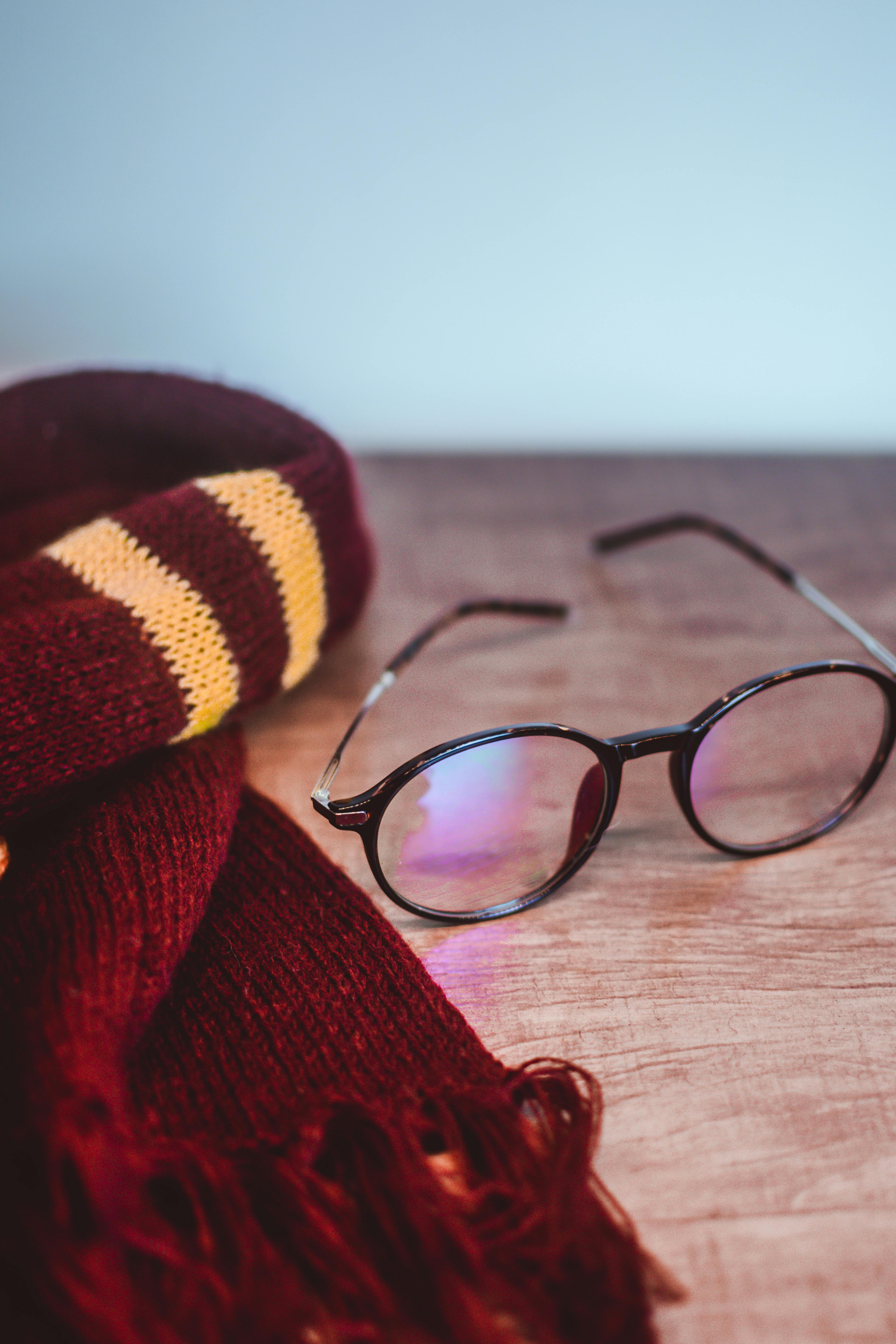 scarf and eyeglasses on the table