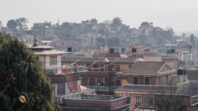A stunning view of Kathmandu's unique architectural skyline during the day. — lounges at Kathmandu Airport