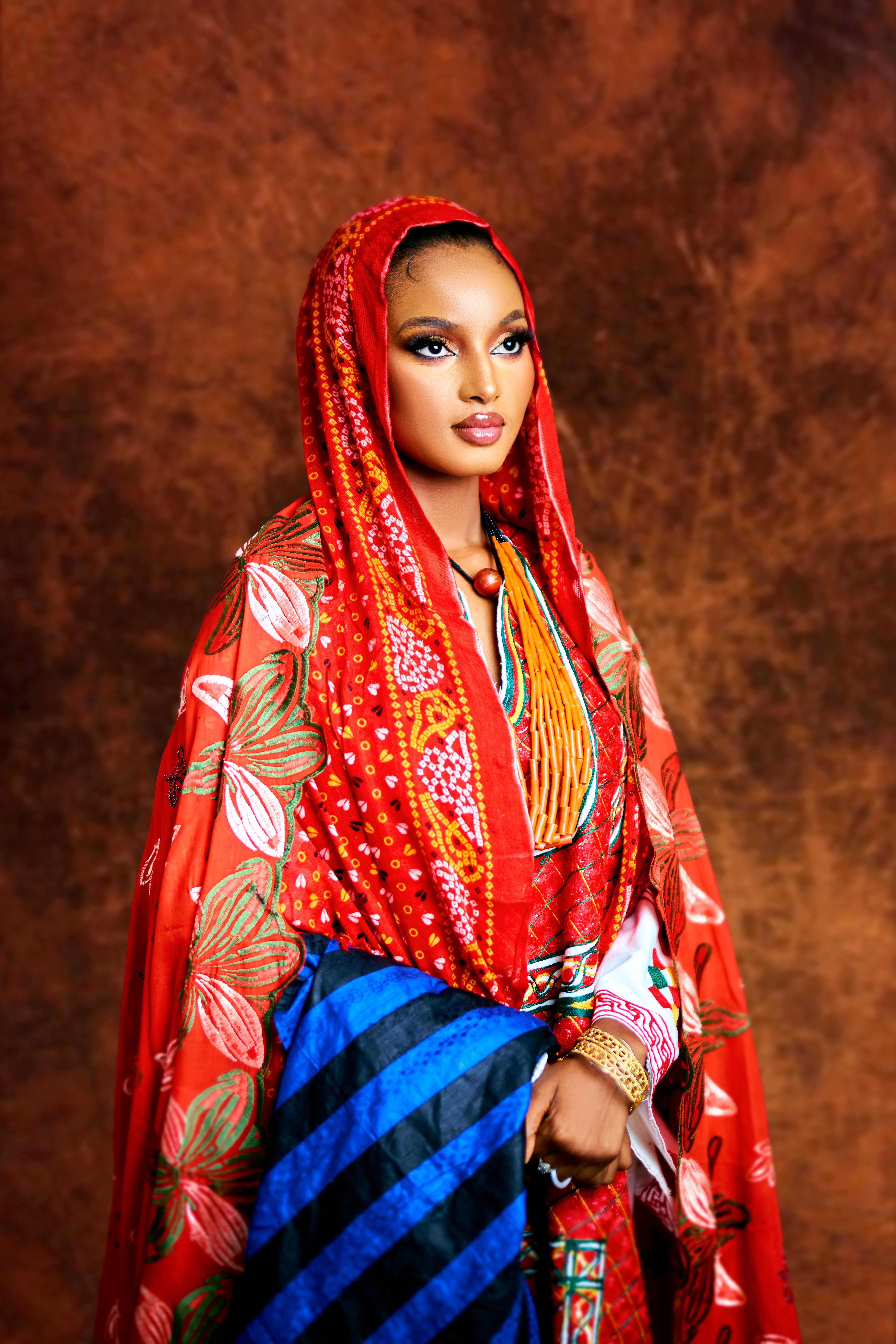 A vibrant portrait of a woman in traditional Nigerian attire, showcasing cultural elegance.