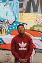 Man in Red Adidas Crew-neck Sweatshirt