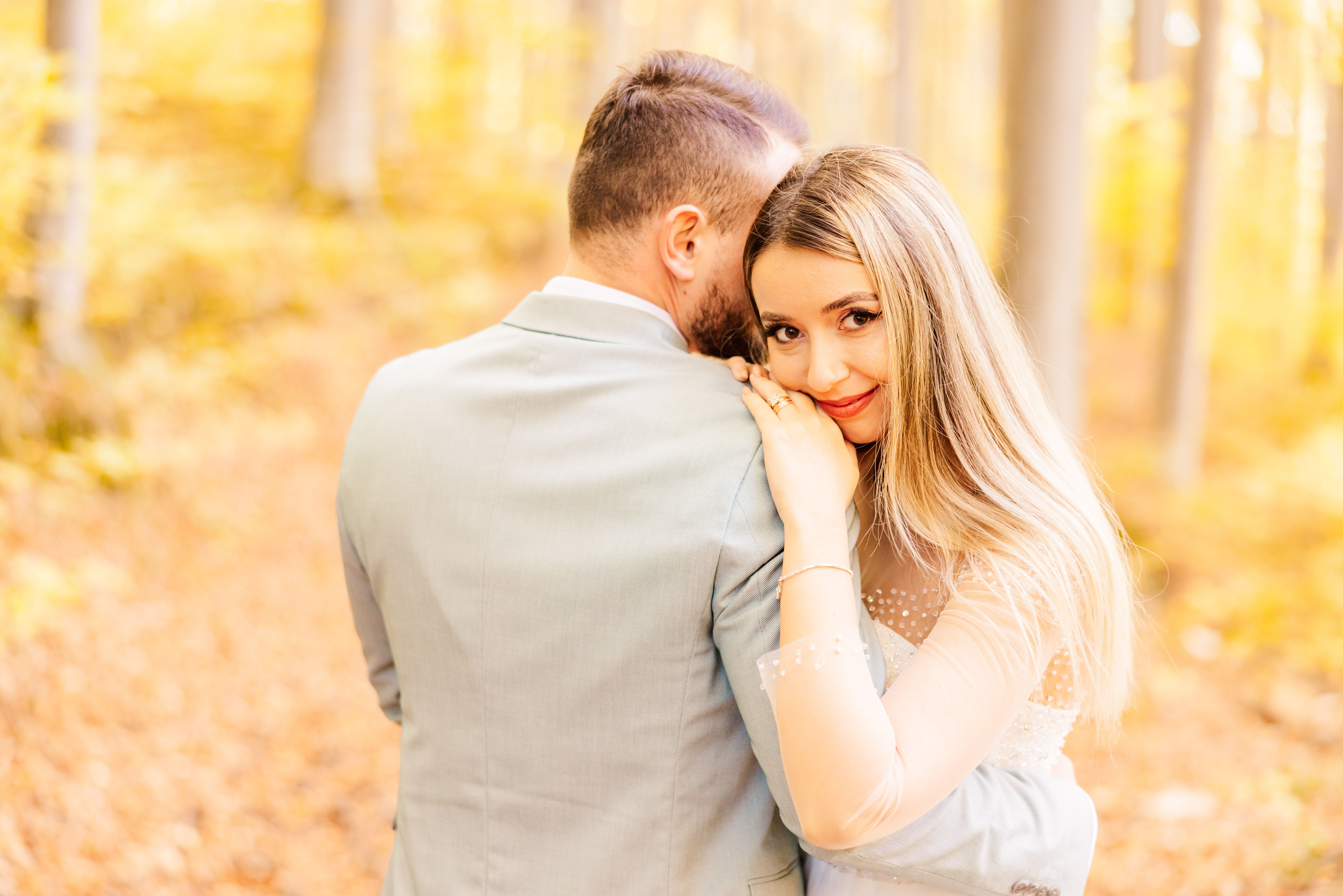 Romantic Couple Embracing in Autumn Forest · Free Stock Photo