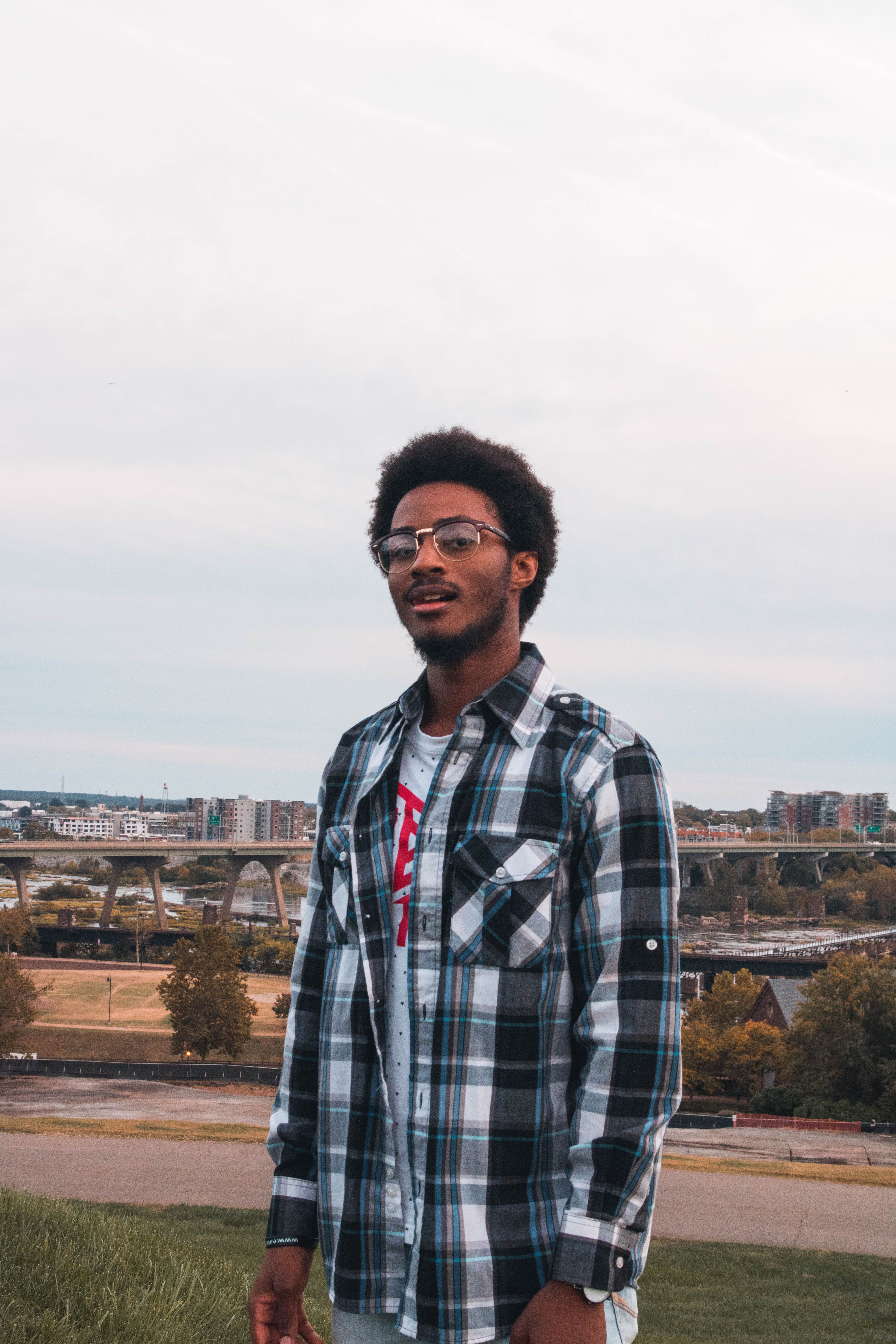 Casual portrait of a man in modern fashion against the Richmond skyline.