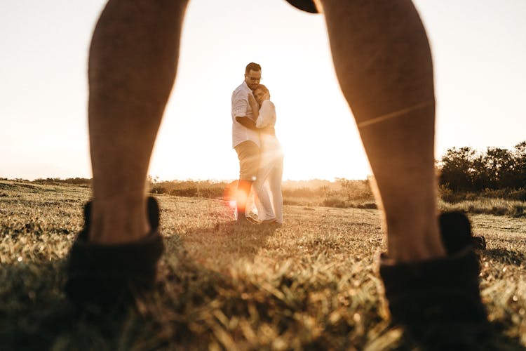 Couple In Grass Field