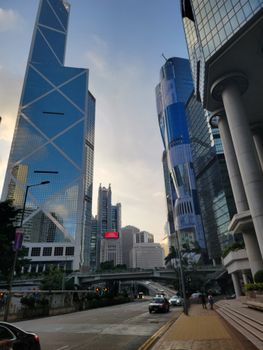 Stunning view of modern skyscrapers in Hong Kong capturing the bustling urban landscape at dusk.