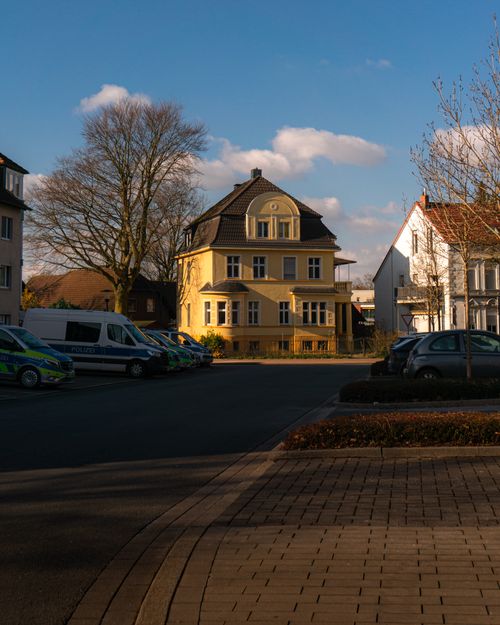 Free A beautiful yellow building in Kamen, Germany, with clear blue skies and classic architecture. Stock Photo