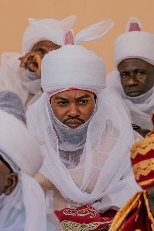 Free Men wearing traditional African attire at a cultural gathering, showcasing rich cultural heritage. Stock Photo