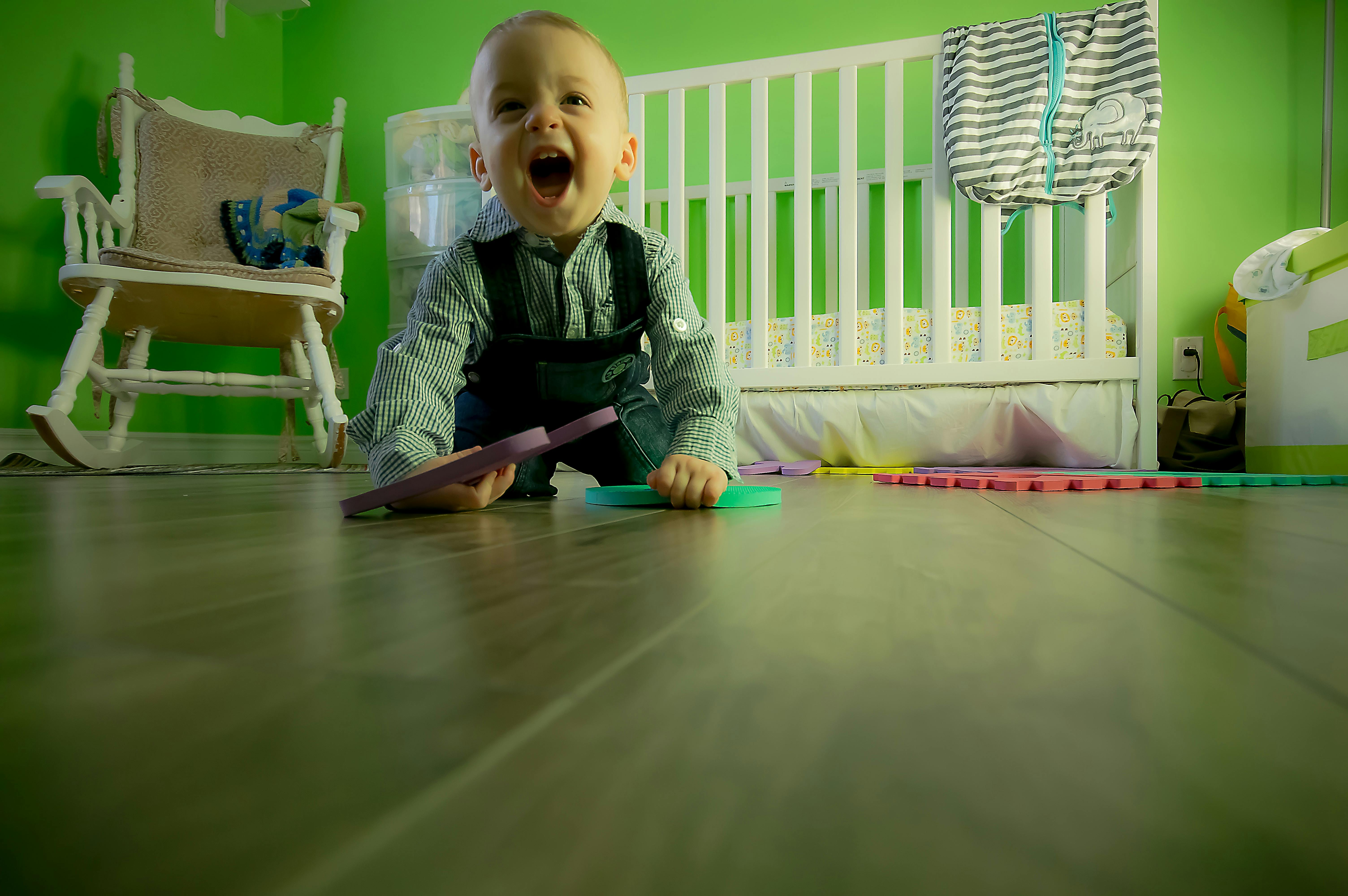 full length of boy sitting on floor