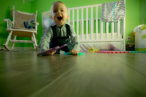 Free Full Length of Boy Sitting on Floor Stock Photo