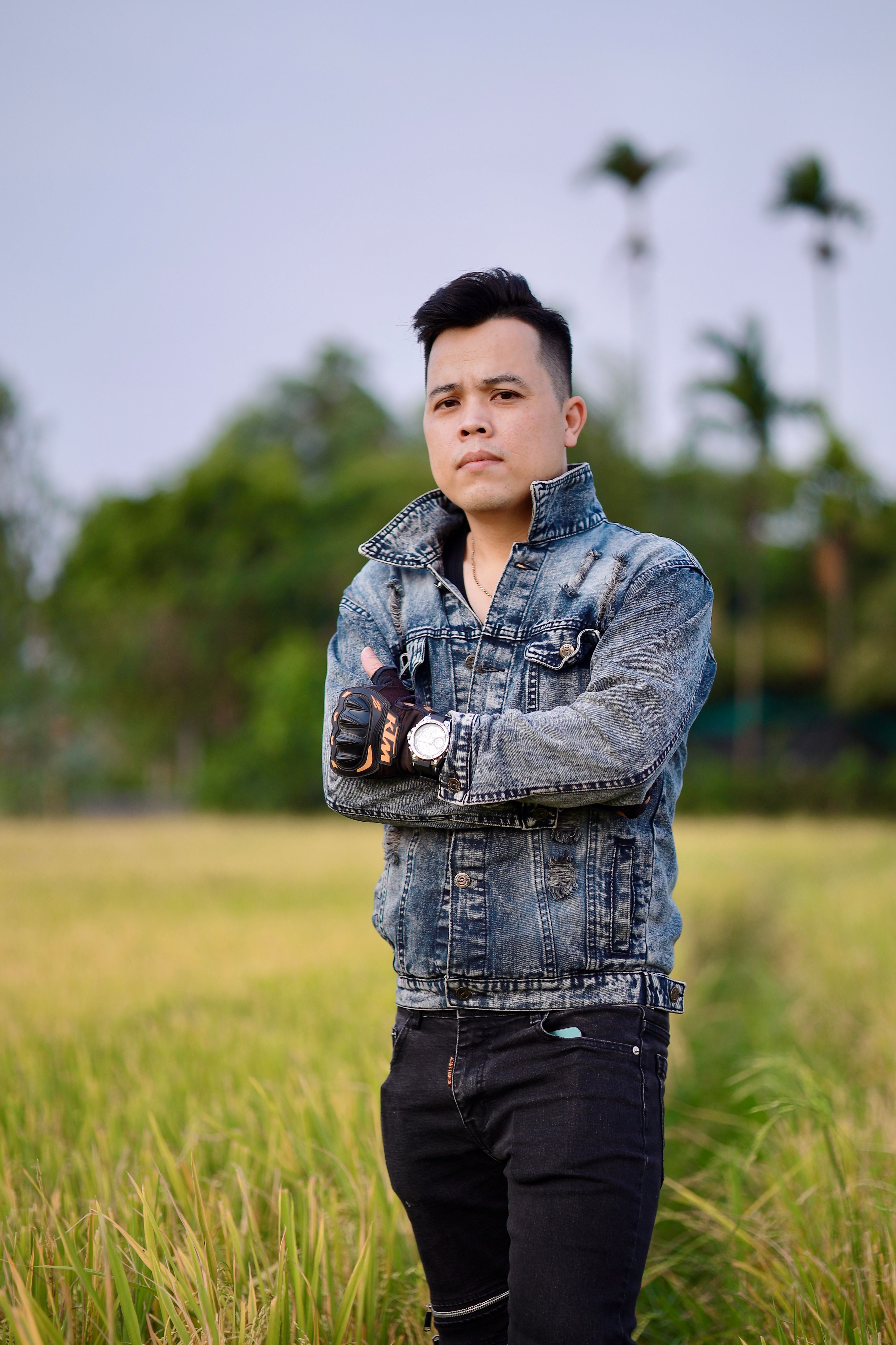 Man in Denim Jacket Posing in Rice Field · Free Stock Photo