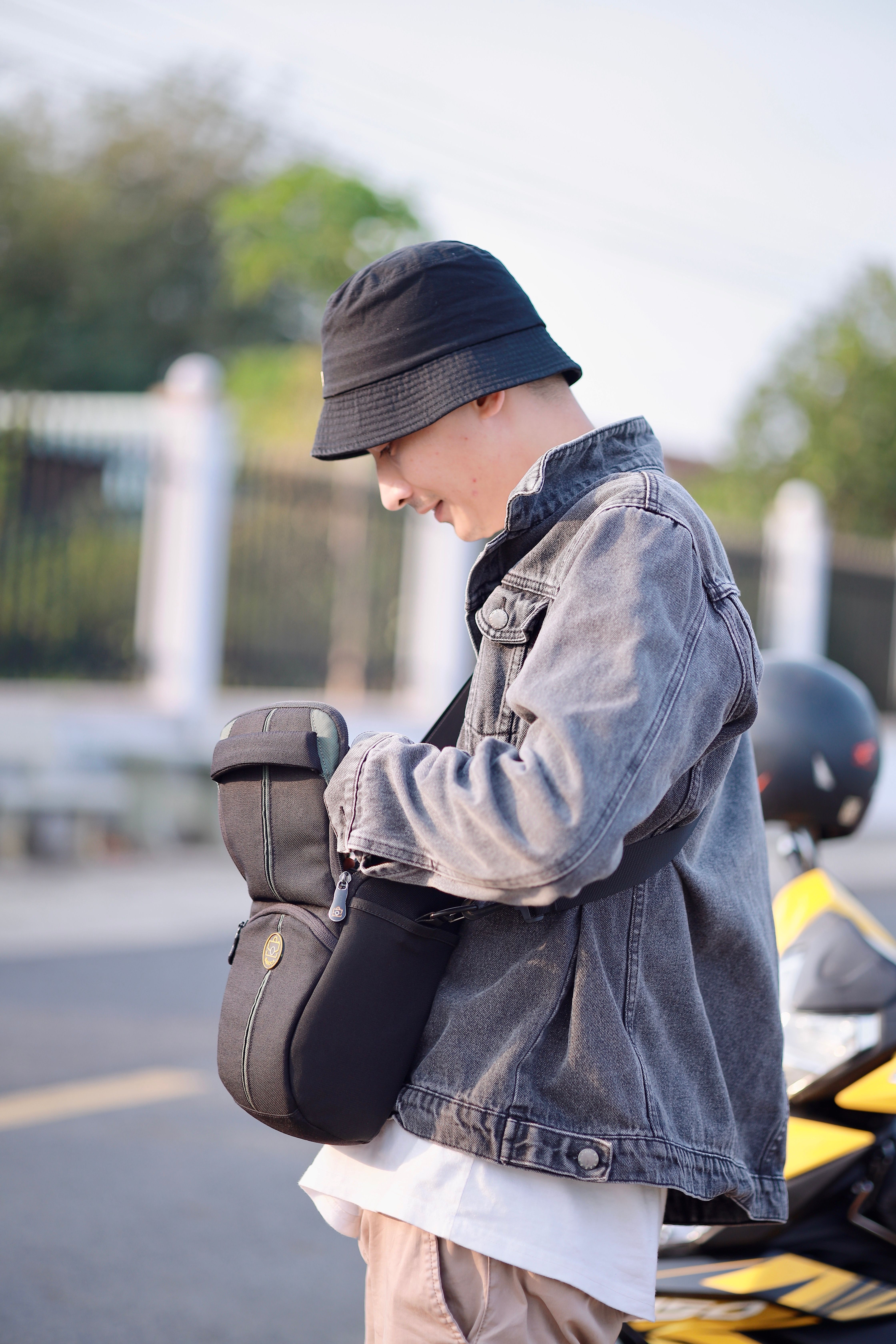 Casual Young Adult with Backpack Outdoors