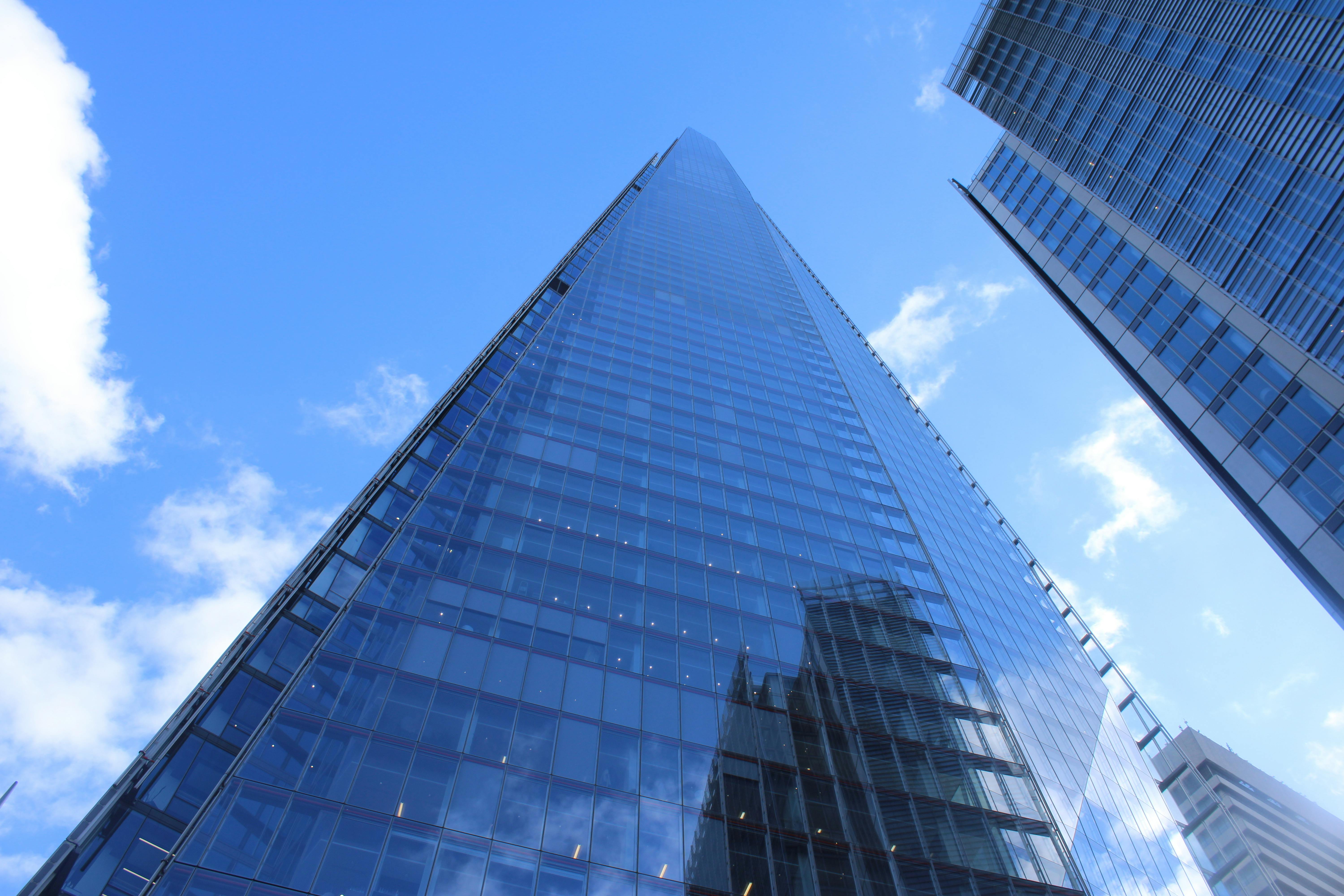 A striking view of The Shard, London's iconic skyscraper, under a clear blue sky.