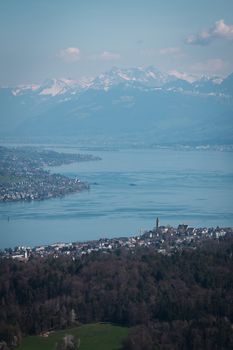 Stunning aerial photo of Zurich Lake with Swiss Alps in the background.