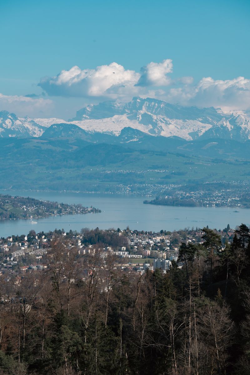 Aerial View of Zurich with Swiss Alps Backdrop · Free Stock Photo