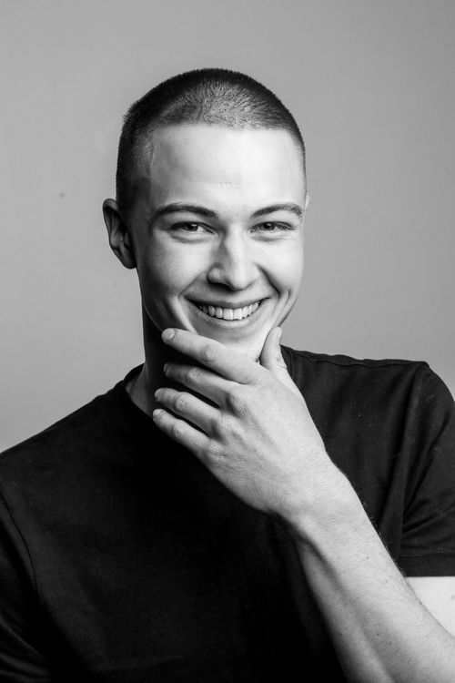Free Engaging black and white portrait of a smiling man in Berlin studio. Stock Photo