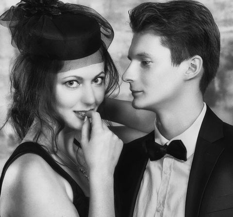 Black and white portrait of a couple in formal attire — photo by Alexander Krivitskiy on Pexels