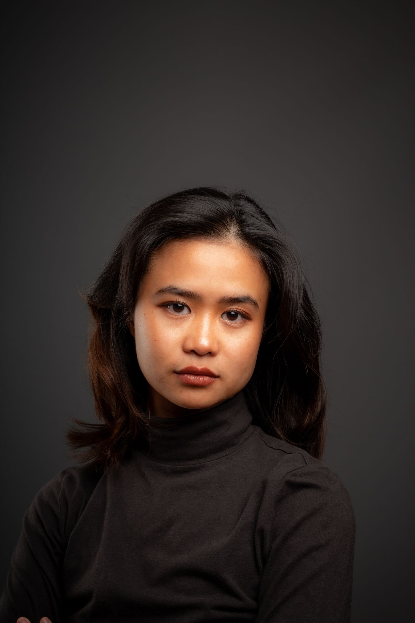 Studio portrait of a performer in a turtleneck