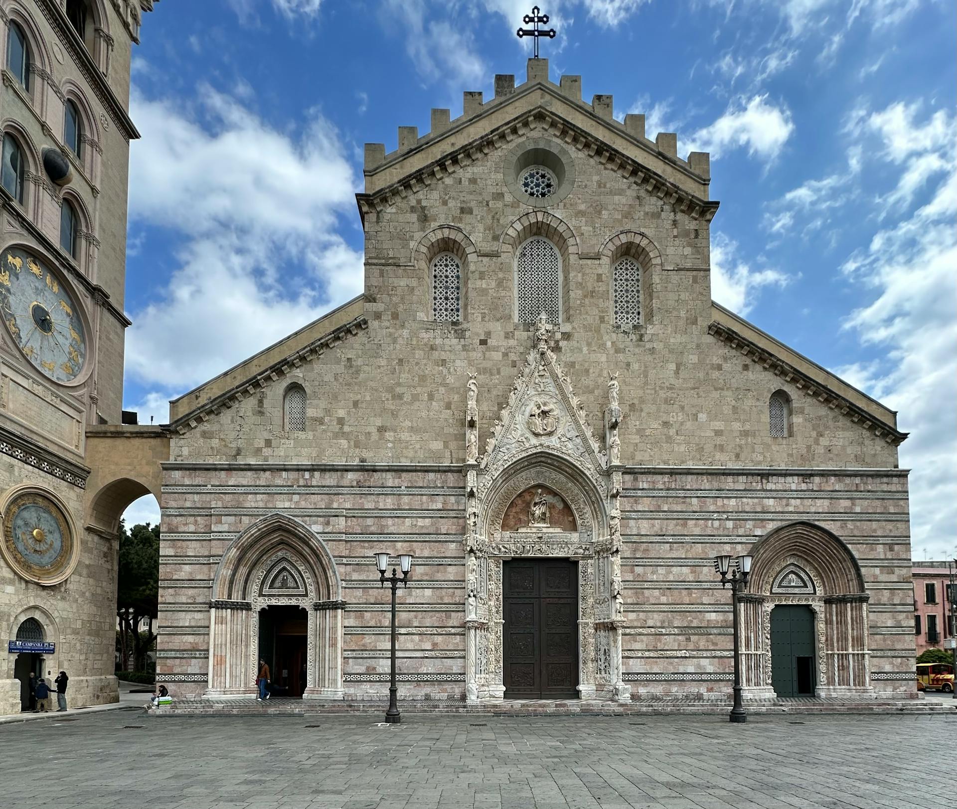 The beautiful Messina Cathedral exterior showcasing its intricate architecture under a bright sky.
