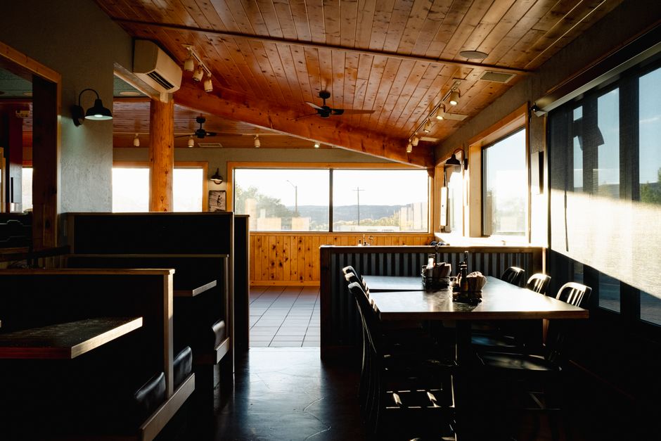 Warm and inviting interior of a classic Arizona roadside diner with natural light.