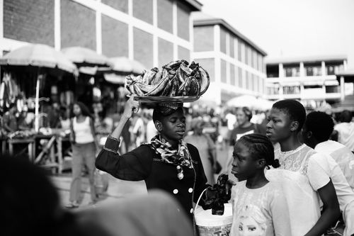Free Black and white photo capturing vibrant street market life in Abuja, Nigeria. Stock Photo