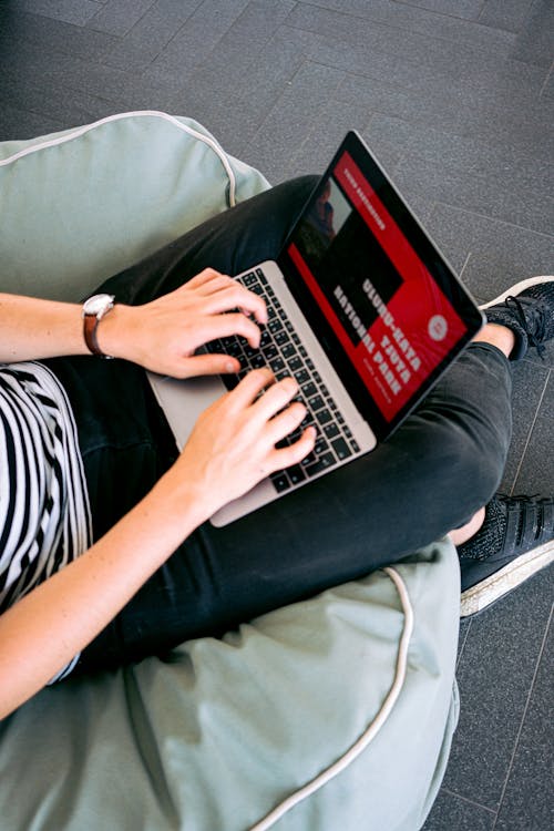 Free Man Creating a Presentation on Laptop Stock Photo