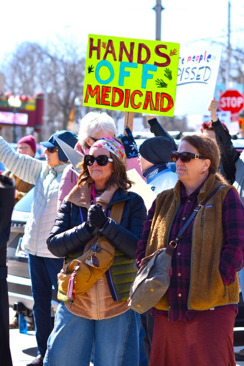 Free A diverse group protests to protect Medicaid, holding signs advocating healthcare rights. Stock Photo
