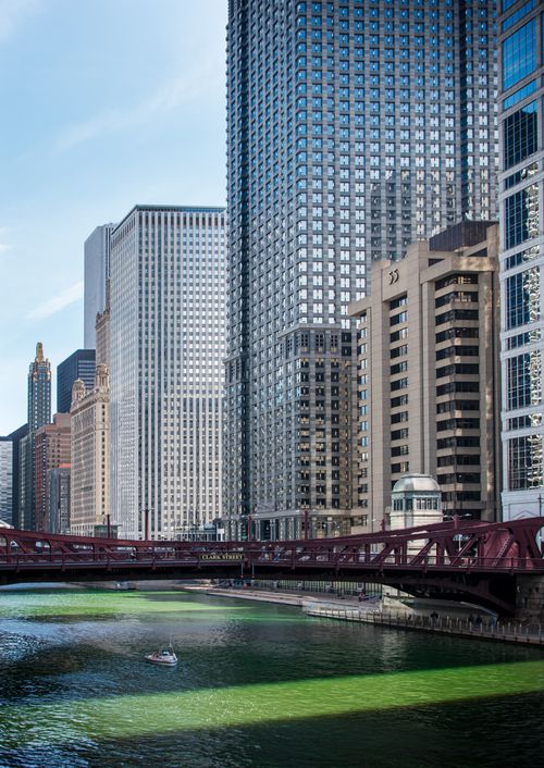 Free Stunning view of the Chicago skyline with the green-tinted river and the Clark Street Bridge in front. Stock Photo