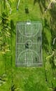 Aerial View of Basketball Court in Lush Hawaiian Landscape
