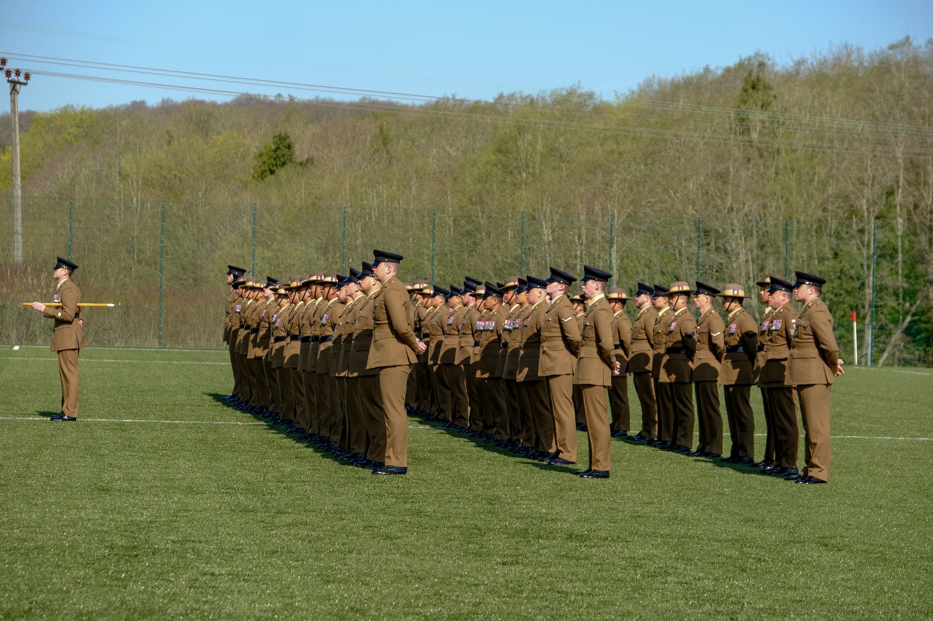 British soldiers standing in formation during a military ceremony at Perham Down, England outdoors.