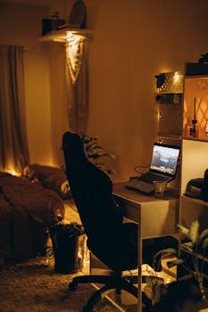 A cozy bedroom with a warm ambiance and workspace setup ideal for relaxation and productivity.