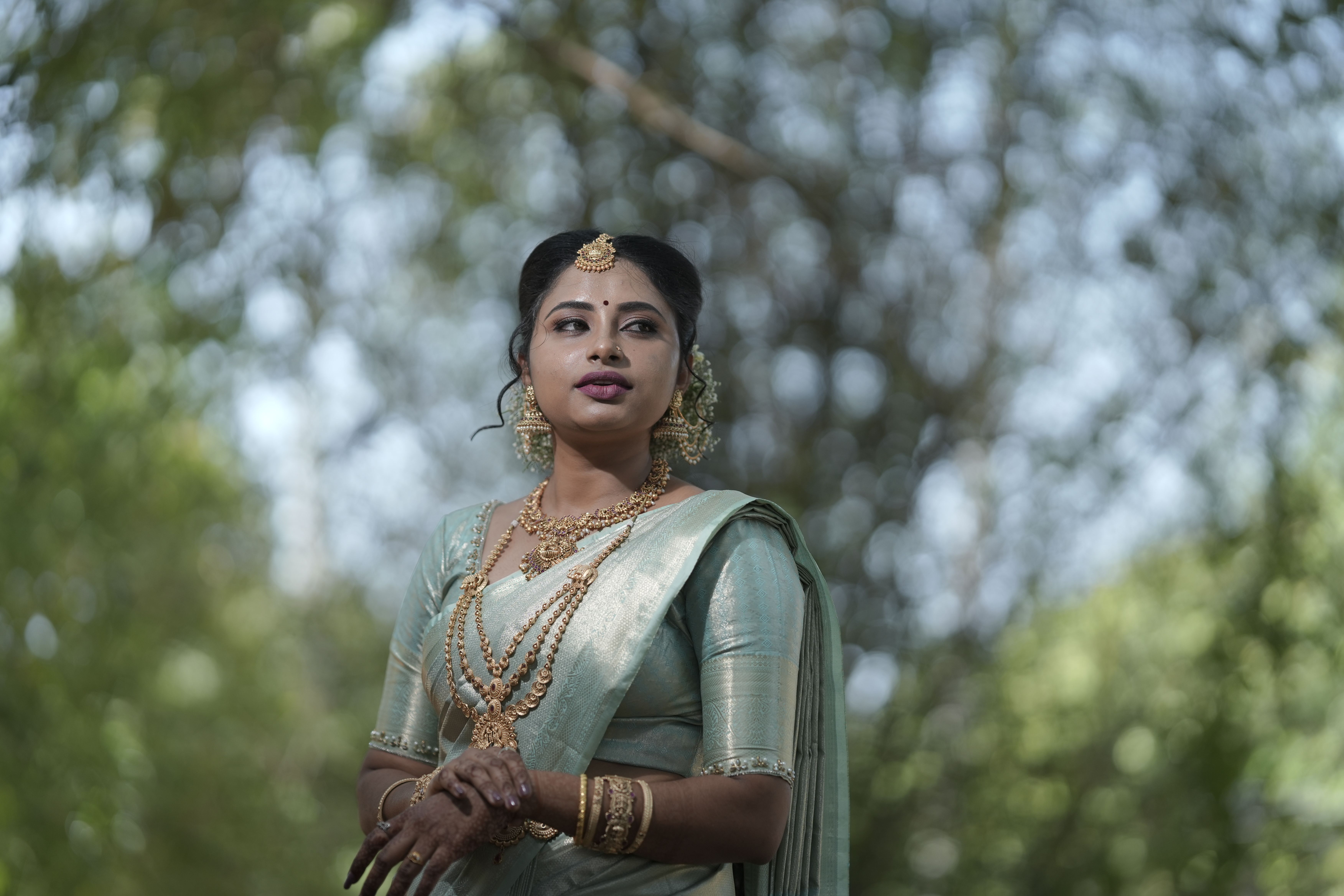 Elegant Woman in Traditional Indian Saree Outdoors · Free Stock Photo