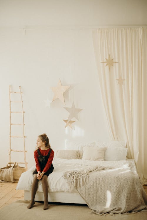 Free Girl Sitting On Bed Stock Photo