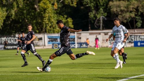 Free Exciting moment from a live football match with players in action on the field. Stock Photo