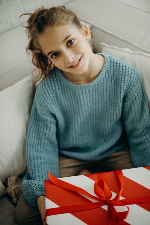 Free Girl Holding A Gift Stock Photo