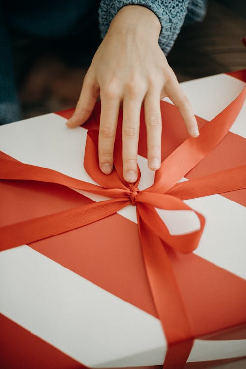 Person Touching A Gift